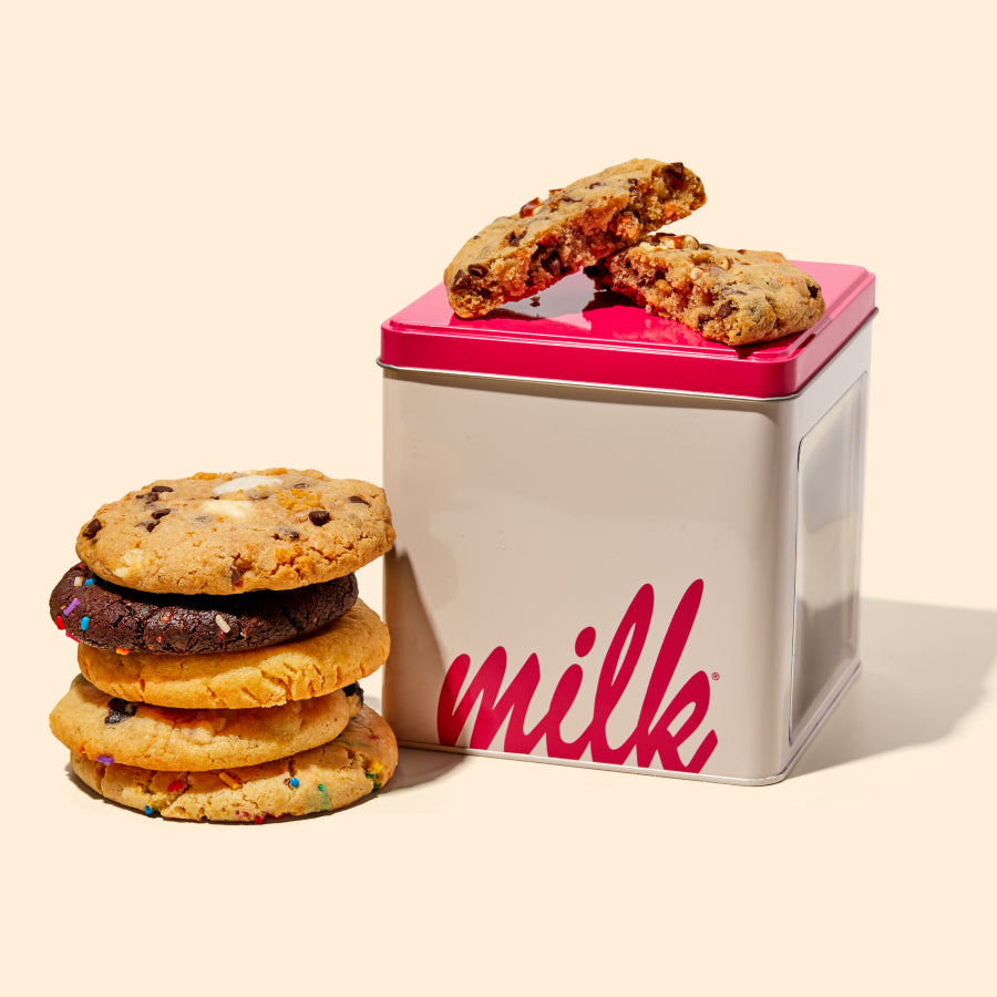 6 count Assorted Cookie Tin with assorted cookies stacked to the side