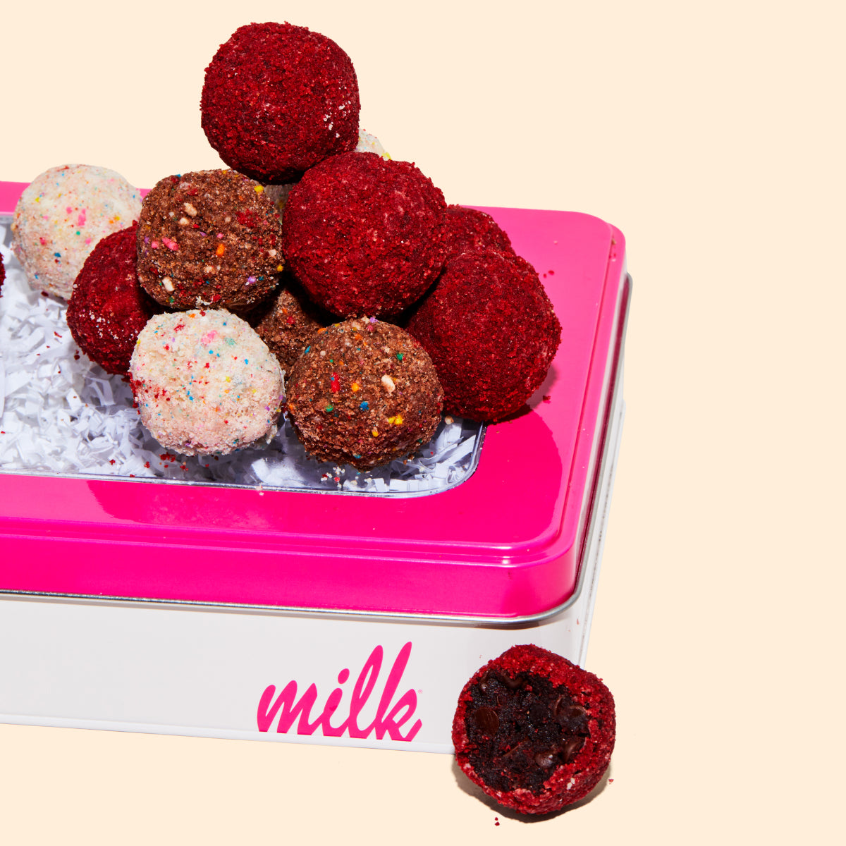 Assorted Truffle Box with a truffle pile on top.