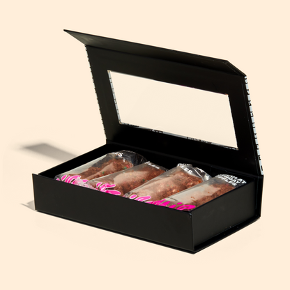 chocolate birthday cake truffle dozen box with the lid opened.